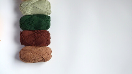 Skeins of Earthy Yarn Isolated on a White Background | Yarn in a Row