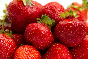 Fresh ripe strawberries. Close-up. Strawberry harvest. White background.