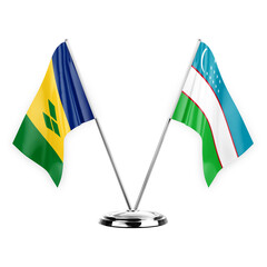 Two table flags isolated on white background 3d illustration, saint vincent and the grenadines and uzbekistan