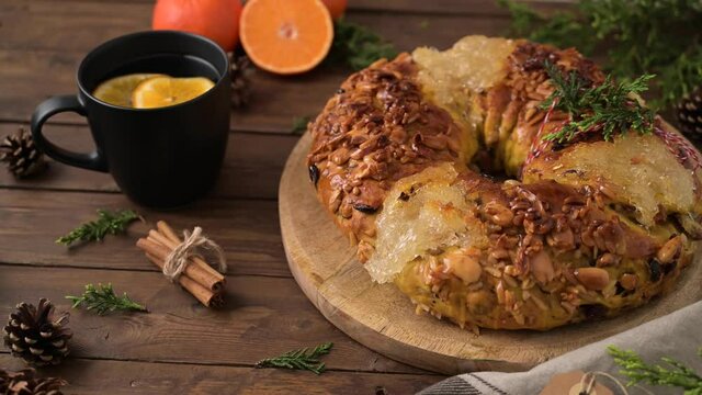Bolo Rainha or Queen's Cake, Made for Christmas, Carnavale or Mardi Gras with hot orange drink in Background.