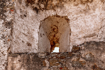 The ruins of the castle Castello Ruffo. Ruin of a Ghost Town in National Park Aspromonte with the Fiumara (river) of Amendolea, Calabria, Italy