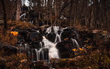 Ramhulta waterfall is 64 meters high and is one of the highest waterfalls in southern Sweden. Captured in the autumn. Long exposure.