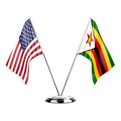 Two table flags isolated on white background 3d illustration, united states of america and zimbabwe - obrazy, fototapety, plakaty