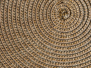 Close up view of circular patterns in a woven placemat