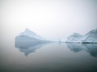 Icebergs on Arctic Ocean in Greenland. Climate Change on Pole region - obrazy, fototapety, plakaty