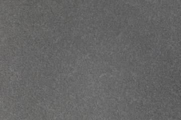 Thick grey fibrous cardboard. Paper background or texture.