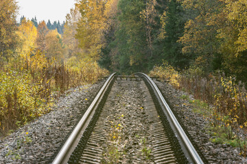 Fototapeta na wymiar Long railway line at autumn day time.