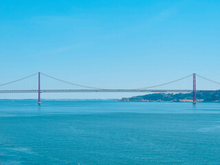 Fototapeta na wymiar View of the 25th April Bridge and the Tejo River - Lisbon, Portugal