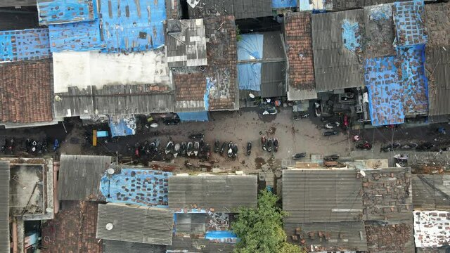 dharavi india bigest slum drone shot early morning covid 19 top shot birds eye view  revile shot going up .