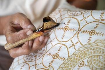 The process of making batik. batik is a handmade traditional art fashion from indonesia. - obrazy, fototapety, plakaty