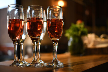 High beautiful glasses filled with rose wine