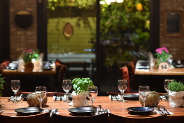 Large elegant wooden table in a rustic style, served for a celebration