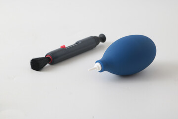A blower and a lenspen to clean the dusty camera and lens.