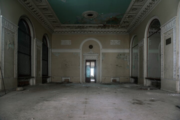 A beautiful lobby with marble columns in an abandoned mansion. Ancient architecture of the USSR....