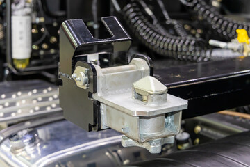 New Twistlock on the front corner of the semitrailer. Transporting shipping containers on trucks on the road. Twistlock in close-up