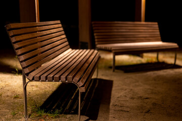 A park shed with empty benches during a pandemic. Meeting places without people. The photo was...