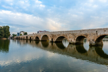 Fototapeta na wymiar TASKOPRU in ADANA, TURKEY. Historical stone bridge on the Seyhan River. (English: Stone Bridge).