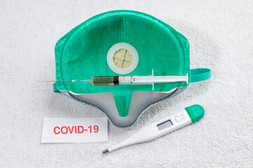 Anti-virus mask mask with syringe and thermometer