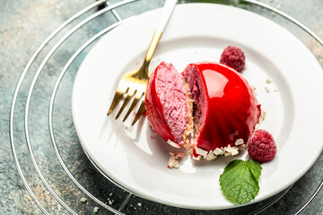 Raspberry glazed cake dessert, cheesecake, trifle, mouse. Food recipe background. Close up