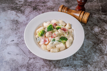 Korean food Spicy Stir-fried Carbonara tteokbokki dish on white plate