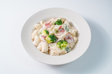 Korean food Spicy Stir-fried Carbonara tteokbokki dish on white plate