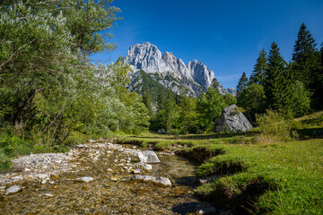 Mountain river in the Klausbachtal, in the background the impressive peaks of the Reiteralm,...