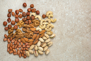 Nuts background, top view. The natural background is made from different varieties of nuts
