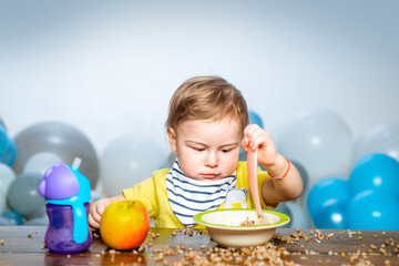 Fototapeta na wymiar Cute baby food, babies eating. Funny kid boy with plate and spoon.