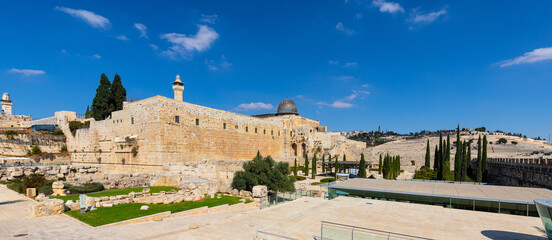Fototapeta na wymiar South-eastern corner of Temple Mount walls with Al-Aqsa Mosque and Davidson Center excavation archeological park in Jerusalem Old City in Israel
