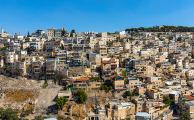 Fototapeta premium Panorama of Mount of Olives with Siloam village over Kidron Valley seen from south wall of Temple Mount in Jerusalem Old City in Israel