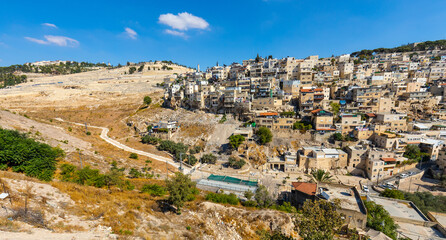 Panorama of Mount of Olives with Siloam village over Kidron Valley seen from south wall of Temple Mount in Jerusalem Old City in Israel