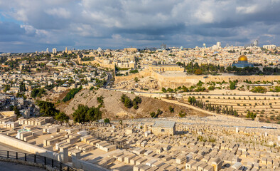 Fototapeta na wymiar Metropolitan Jerusalem panorama with Temple Mount and Old City with historic Jewish cemetery on slope of Mount of Olives in Israel
