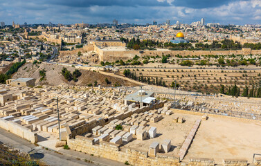 Metropolitan Jerusalem panorama with Temple Mount and Old City with historic Jewish cemetery on slope of Mount of Olives in Israel