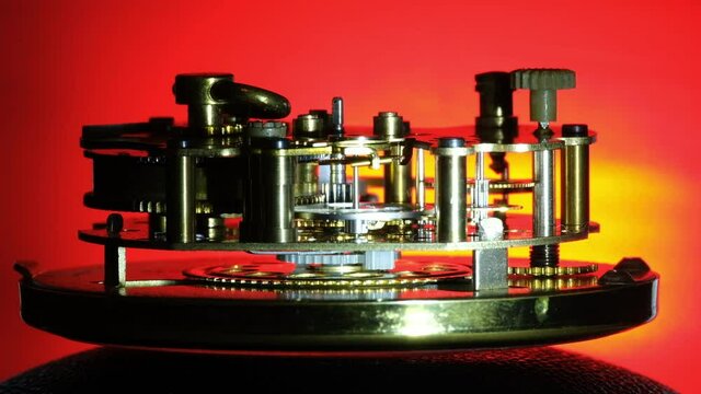 Internal workings of analogue small spring powered clock.