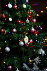 Fototapeta na wymiar beautifully decorated with toys artificial Christmas tree