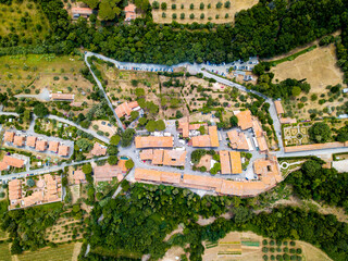 Aerial Drone view Bolgheri dall'alto, Viale dei Cipressi, cypress road and olive trees in Livorno Tuscany, Italy
