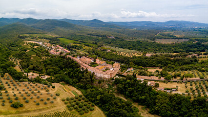 Aerial Drone view Bolgheri dall'alto, Viale dei Cipressi, cypress road and olive trees in Livorno Tuscany, Italy - obrazy, fototapety, plakaty