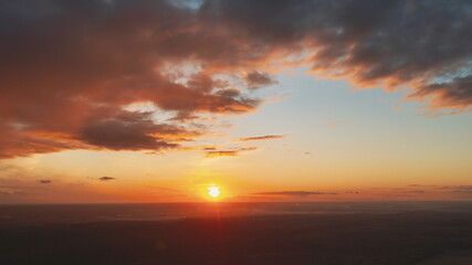 Aerial View Of Sunshine Bright Dramatic Sky. Scenic Colorful Sky At Dawn. Sunset Sky Above Autumn Field And Meadow, Forest Landscape In Evening. Top View From High Attitude. Hyper