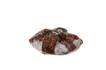 macro mineral stone Staurolite on a white background