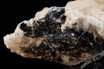 macro stone mineral Quartz on Galena on a black background