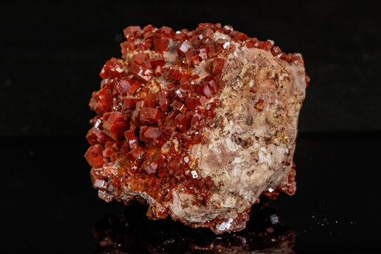 Macro mineral stone Vanadinite on a black background
