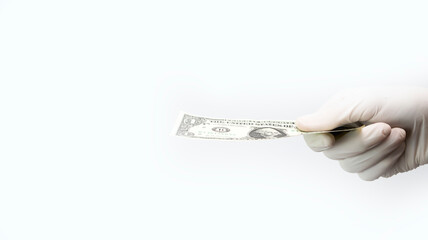 1 dollar bill in hands in medical gloves holds a man in a sick mask, a concept on the medical theme of the costs of treatment and insurance cases of coronavirus covid-19.