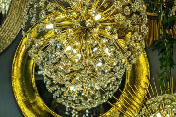 crystal of contemporary chandelier, a branched ornamental light fixture designed to be mounted on ceilings or walls.