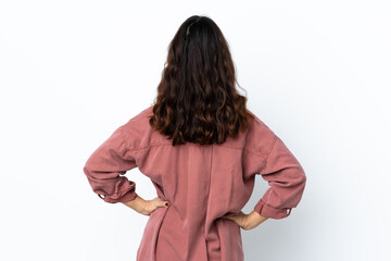 Young photographer woman over isolated white background in back position