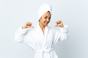 Young woman in bathrobe over isolated white background proud and self-satisfied