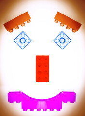 laughing face from the toy blocks on the white