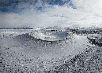 Aerial drone panorama snowy winter landscape view of huge volcano cone crater Hverfjall near Myvatn Reykjahlid Northern Iceland Europe © Mathias