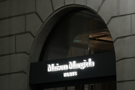 Maison Margiela logo displayed on a facade of a store in Milan.