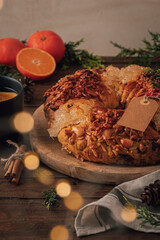Bolo rainha or queen's cake is a traditional portuguese Xmas cake with fruits raisins nut on kitcthen countertop. Served with orange tea. Is made for Christmas, Carnavale or Mardi Gras