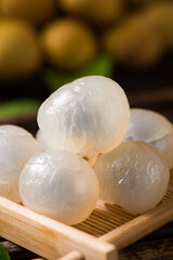 fresh peeled longans on wooden background